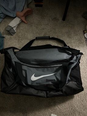 Nike Black and Gray Duffel Bag with White Swoosh